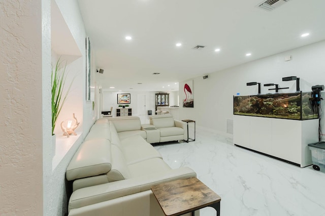 living room featuring marble finish floor, recessed lighting, and visible vents