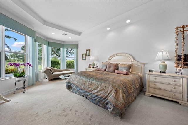 bedroom with carpet, recessed lighting, and multiple windows