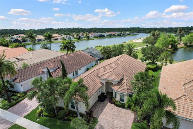 aerial perspective of suburban area featuring a nearby body of water