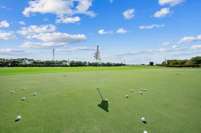 view of community with golf course view and a putting area