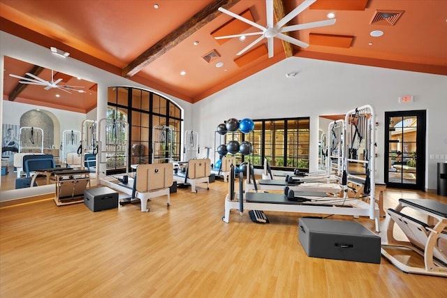 exercise room featuring ceiling fan, wood finished floors, beam ceiling, high vaulted ceiling, and recessed lighting
