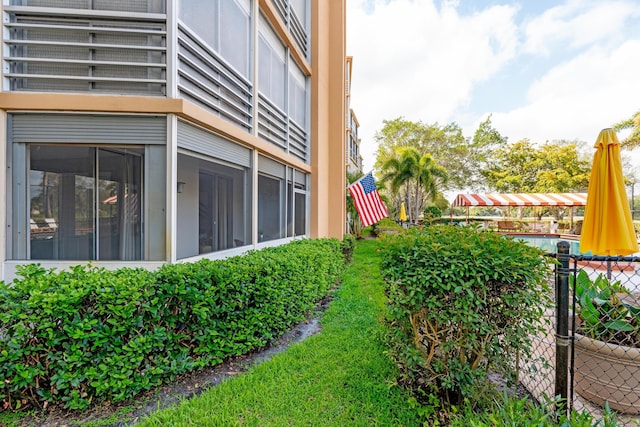 view of property exterior featuring fence
