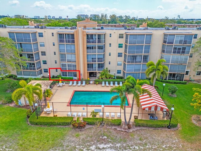 6461 NW 2nd Ave Unit 109, Boca Raton, FL 33487 - community pool featuring a patio area