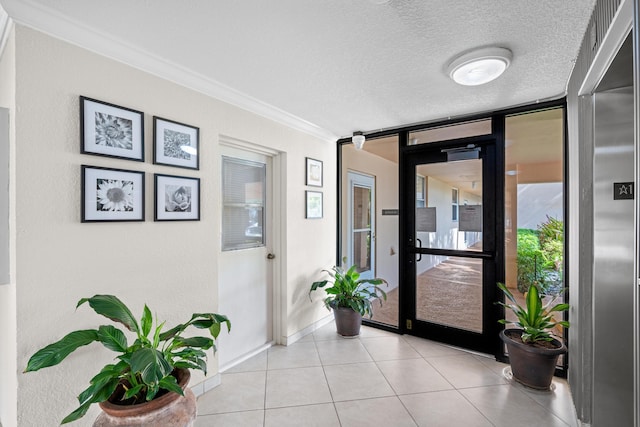 6461 NW 2nd Ave Unit 109, Boca Raton, FL 33487 - entrance foyer featuring ornamental molding, baseboards, light tile patterned floors, a textured ceiling, and a wall of windows