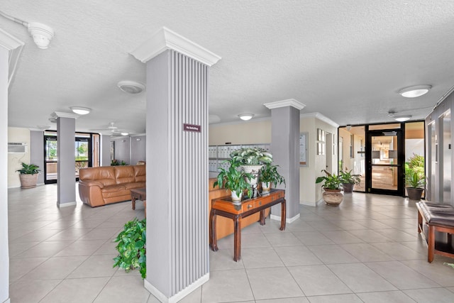 building lobby with a textured ceiling and crown molding