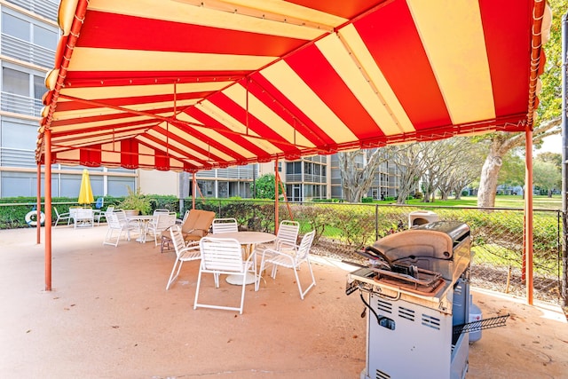 view of patio / terrace with outdoor dining area and fence