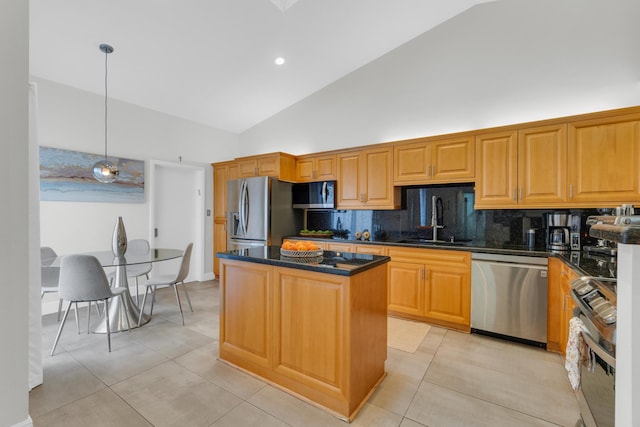 kitchen with high vaulted ceiling, a center island, a sink, stainless steel appliances, and backsplash