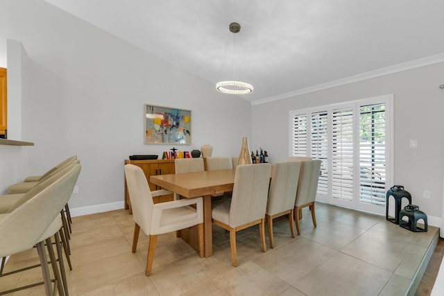 dining room featuring a notable chandelier, baseboards, and ornamental molding