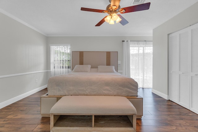 bedroom featuring baseboards, crown molding, hardwood / wood-style flooring, and ceiling fan