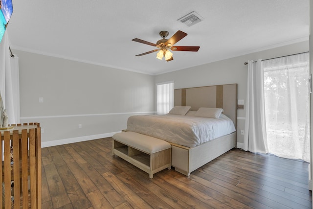 bedroom featuring visible vents, crown molding, baseboards, and dark wood-style flooring