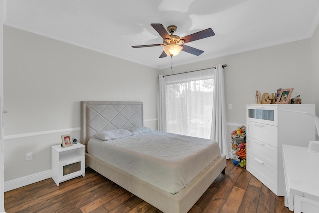 bedroom with baseboards, ornamental molding, ceiling fan, and dark wood-style flooring