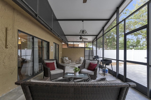 sunroom with ceiling fan and an outdoor hangout area