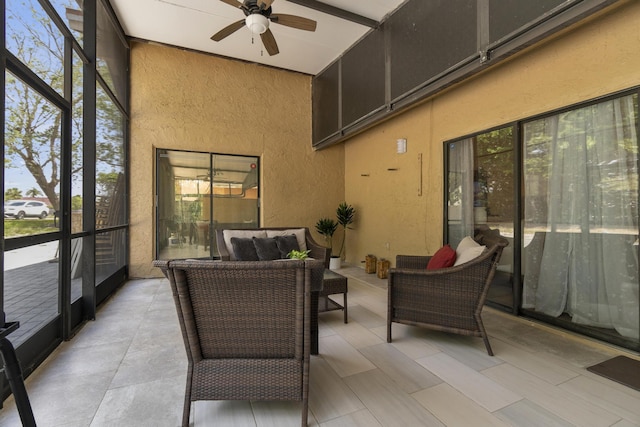 sunroom / solarium with an outdoor hangout area, a wealth of natural light, and ceiling fan