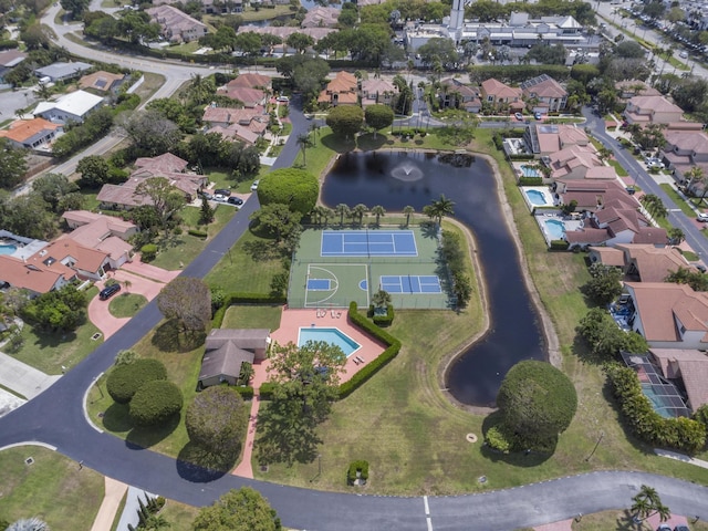bird's eye view with a residential view and a water view