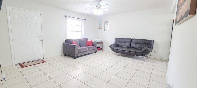 sitting room featuring light tile patterned floors and a ceiling fan
