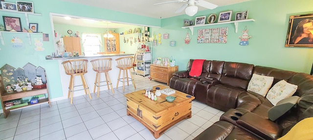 tiled living area featuring ceiling fan