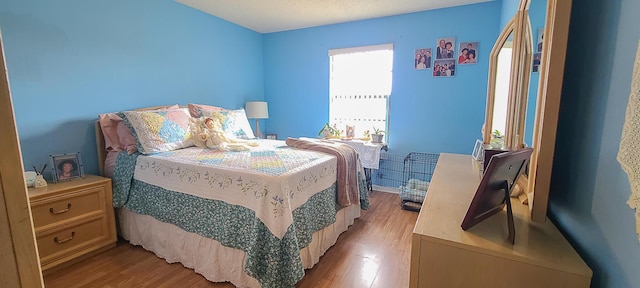 bedroom with wood finished floors