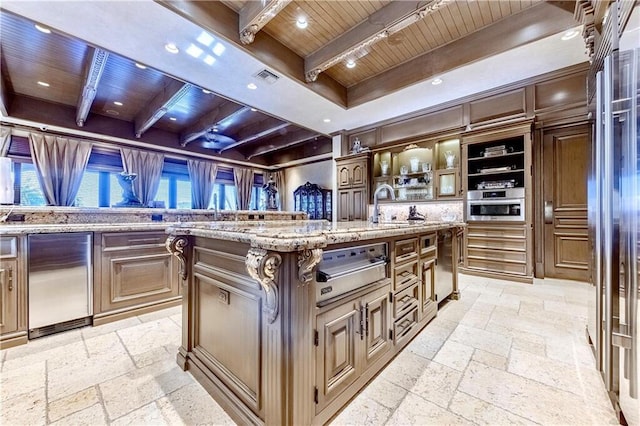 3131 NE 27th Ave, Lighthouse Point, FL 33064 - kitchen featuring wood ceiling with exposed beams, stone tile floors, a warming drawer, a kitchen island with sink, and recessed lighting