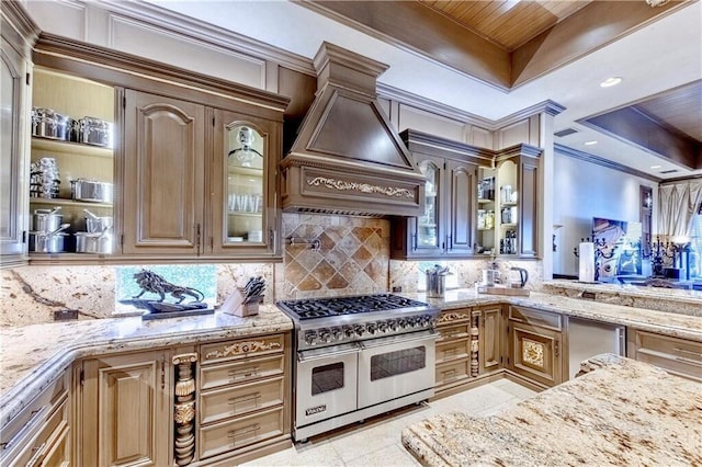 3131 NE 27th Ave, Lighthouse Point, FL 33064 - kitchen with double oven range, ornamental molding, premium range hood, backsplash, and light stone counters