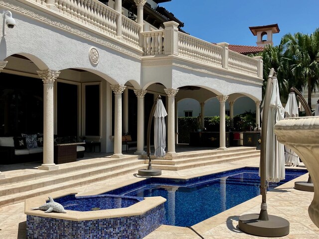 3131 NE 27th Ave, Lighthouse Point, FL 33064 - view of pool with a patio, outdoor lounge area, and a pool with connected hot tub