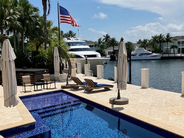 3131 NE 27th Ave, Lighthouse Point, FL 33064 - outdoor pool featuring a covered hot tub, a water view, a patio, and a boat dock