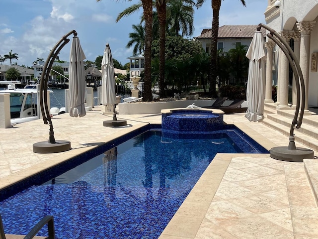 3131 NE 27th Ave, Lighthouse Point, FL 33064 - view of pool with a patio and a pool with connected hot tub