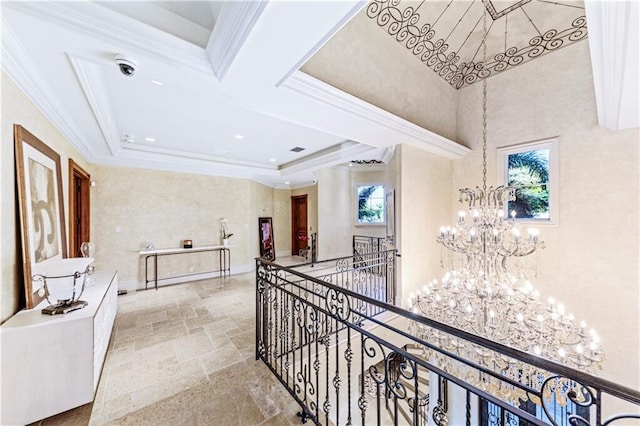 3131 NE 27th Ave, Lighthouse Point, FL 33064 - hallway with a chandelier, an upstairs landing, plenty of natural light, crown molding, and stone finish flooring