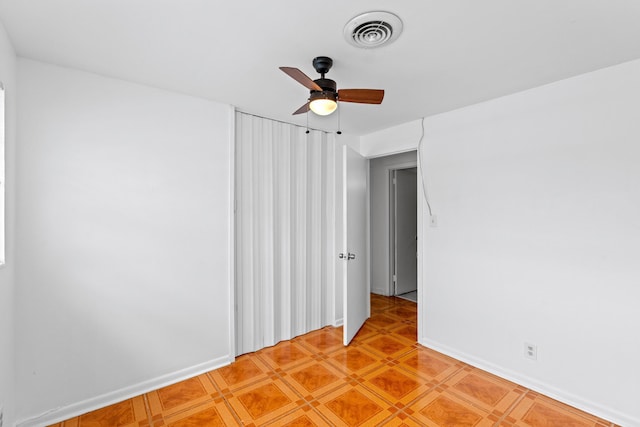 3700 N Australian Ave, West Palm Beach, FL 33407 - spare room featuring a ceiling fan and baseboards