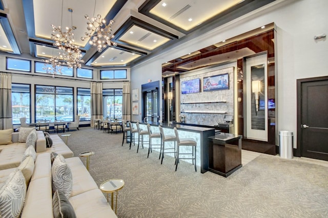 interior space with an inviting chandelier, recessed lighting, carpet flooring, a high ceiling, and coffered ceiling