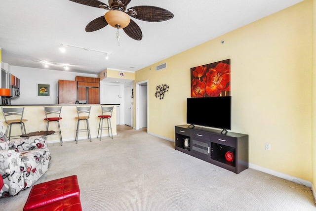 1551 N Flagler Dr Unit 1509, West Palm Beach, FL 33401 - living area featuring light carpet, baseboards, a ceiling fan, and visible vents