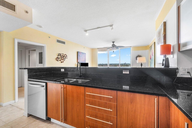 1551 N Flagler Dr Unit 1509, West Palm Beach, FL 33401 - kitchen with a sink, visible vents, dishwasher, and brown cabinets