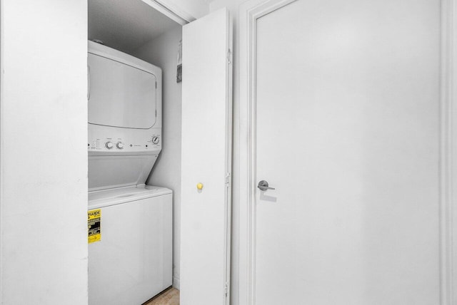 1551 N Flagler Dr Unit 1509, West Palm Beach, FL 33401 - laundry area featuring stacked washing maching and dryer and laundry area