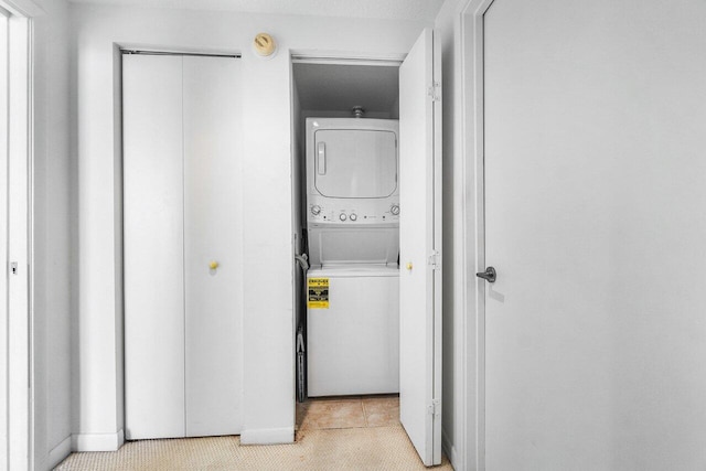 1551 N Flagler Dr Unit 1509, West Palm Beach, FL 33401 - laundry room featuring stacked washer / dryer and laundry area