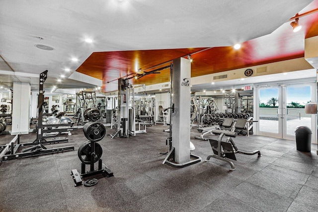 1551 N Flagler Dr Unit 1509, West Palm Beach, FL 33401 - gym with visible vents, a textured ceiling, and french doors