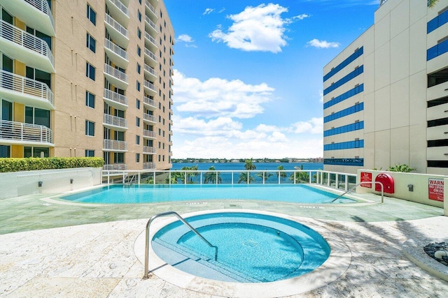 1551 N Flagler Dr Unit 1509, West Palm Beach, FL 33401 - pool featuring a community hot tub