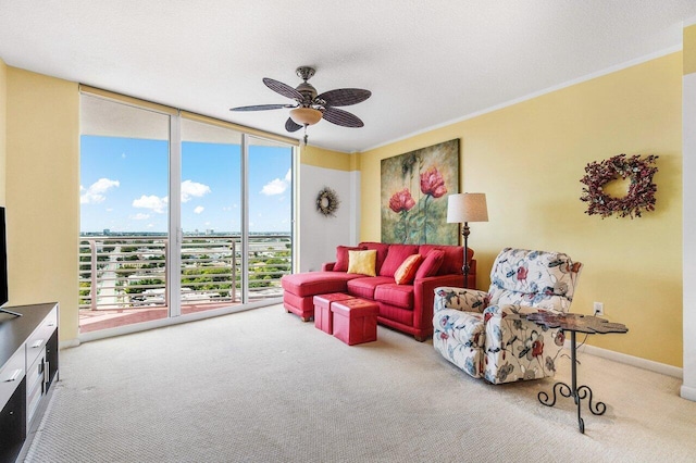 1551 N Flagler Dr Unit 1509, West Palm Beach, FL 33401 - carpeted living room featuring expansive windows, a textured ceiling, ornamental molding, a ceiling fan, and baseboards