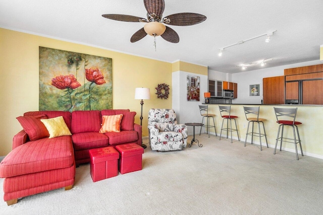 1551 N Flagler Dr Unit 1509, West Palm Beach, FL 33401 - living room featuring crown molding, ceiling fan, rail lighting, carpet, and baseboards