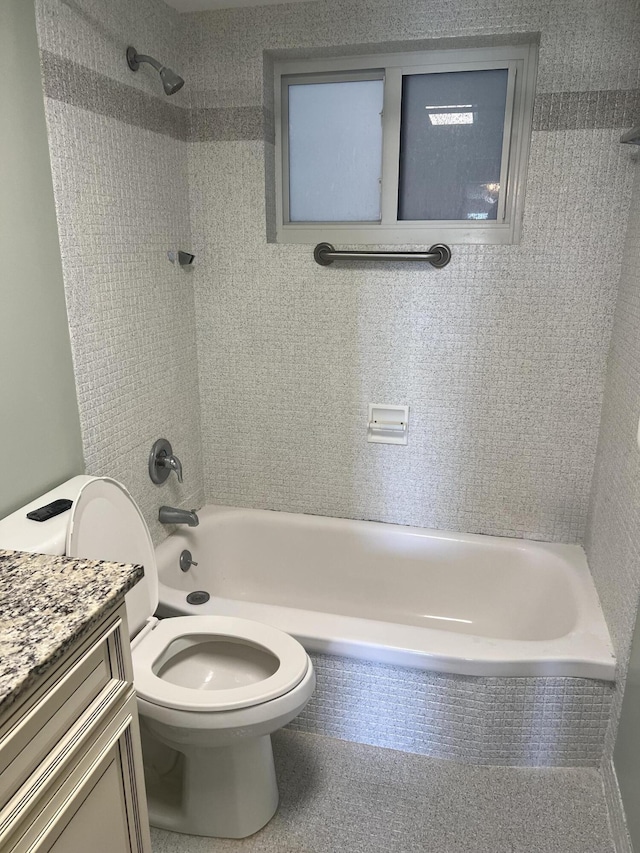full bathroom featuring toilet, vanity, and  shower combination