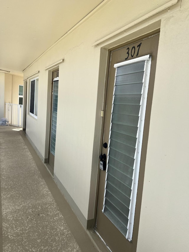 property entrance featuring stucco siding
