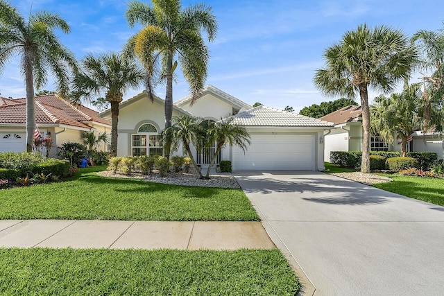 7313 SE Seagate Ln, Stuart, FL 34997 - view of front of property with stucco siding, driveway, a front yard, a tile roof, and a garage