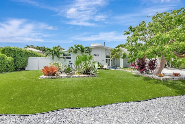 view of yard featuring fence and a gate