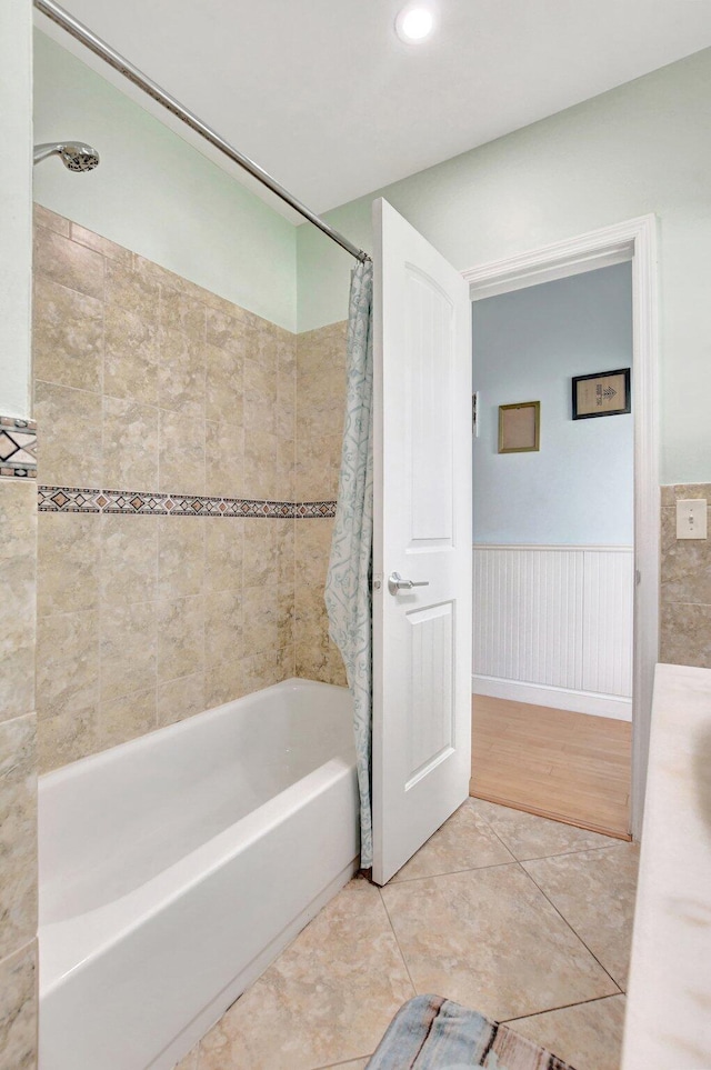 bathroom featuring shower / tub combo, tile patterned floors, recessed lighting, and wainscoting