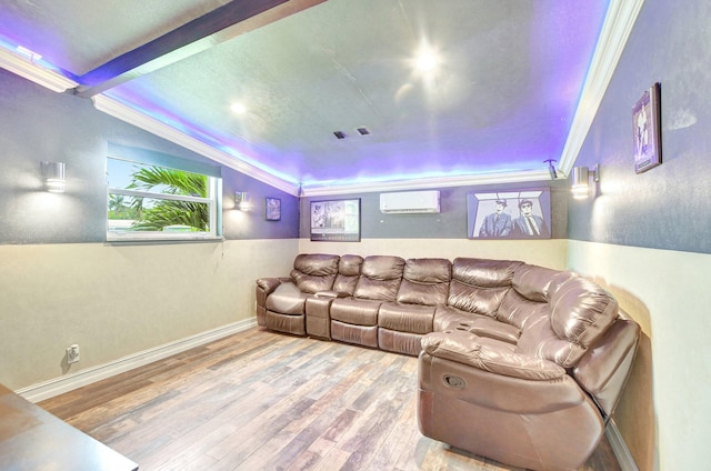 cinema featuring a wall mounted AC, plenty of natural light, and wood finished floors
