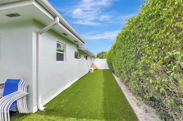 view of yard with a fenced backyard