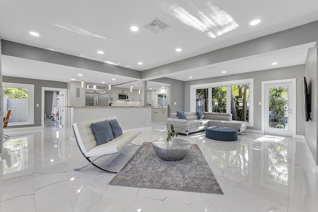 1900 NE 16th Ter, Fort Lauderdale, FL 33305 - living room featuring marble finish floor, visible vents, and recessed lighting