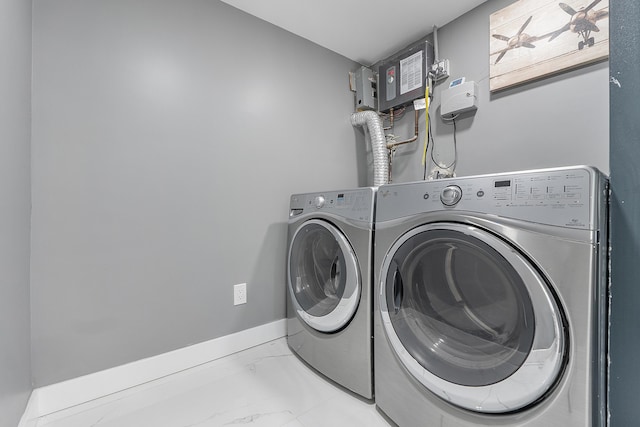 1900 NE 16th Ter, Fort Lauderdale, FL 33305 - laundry room featuring independent washer and dryer, marble finish floor, and laundry area