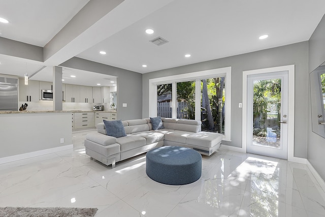 1900 NE 16th Ter, Fort Lauderdale, FL 33305 - living area featuring marble finish floor, baseboards, visible vents, and recessed lighting