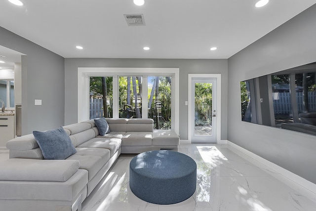 1900 NE 16th Ter, Fort Lauderdale, FL 33305 - living room featuring marble finish floor, baseboards, visible vents, and recessed lighting