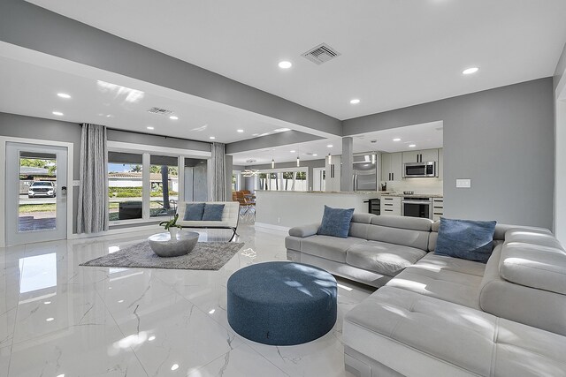 1900 NE 16th Ter, Fort Lauderdale, FL 33305 - living area with marble finish floor, visible vents, and recessed lighting