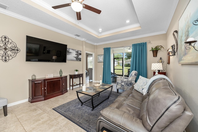 7753 SW 86th Loop, Ocala, FL 34476 - living room with ceiling fan, a tray ceiling, ornamental molding, baseboards, and recessed lighting